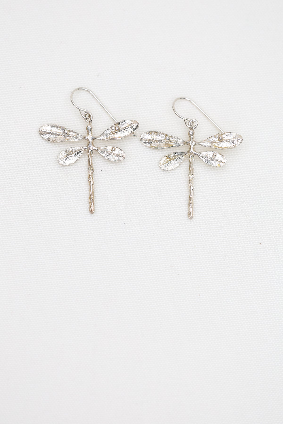 Dragonfly dangles lightweight and made in sterling silver or brass, lost wax cast